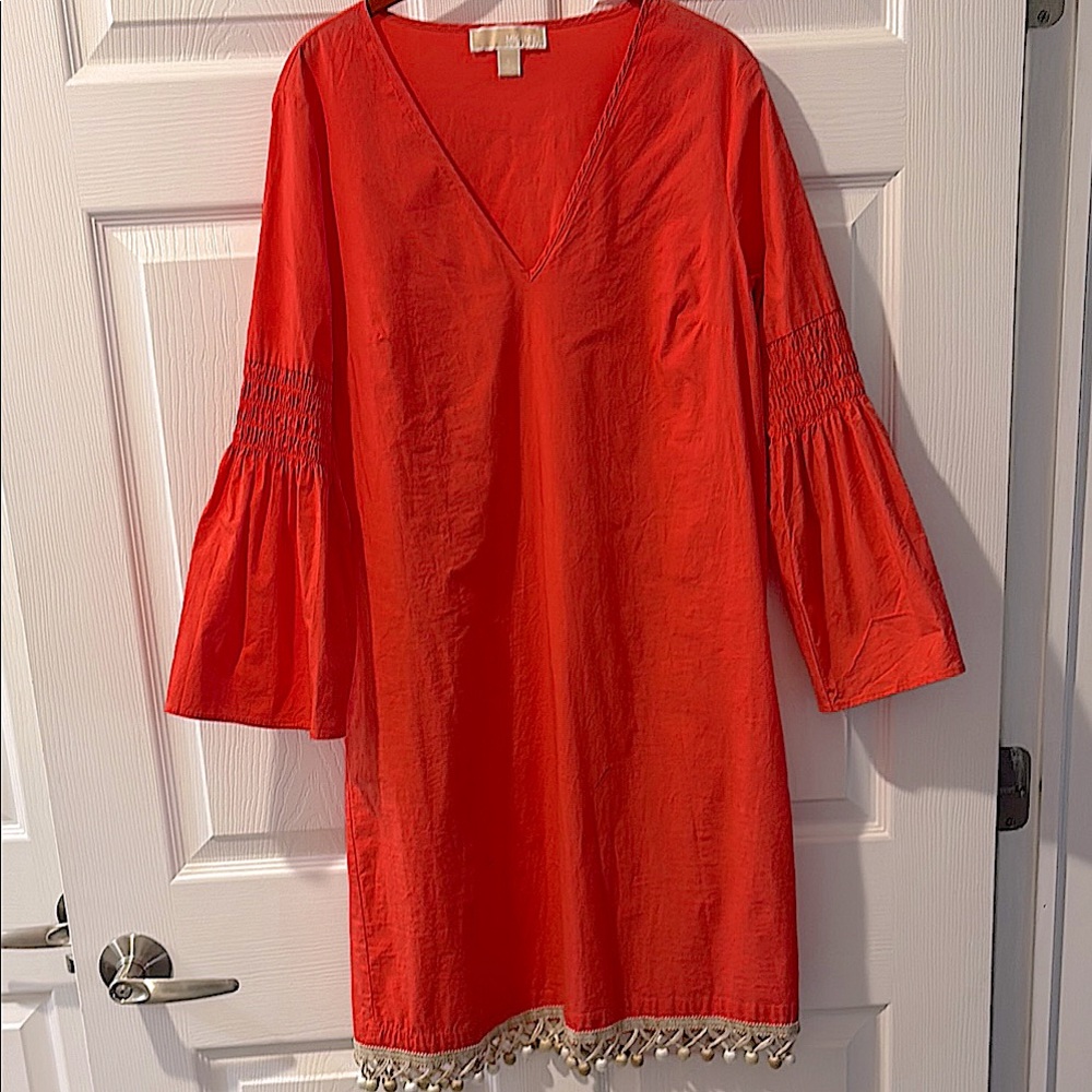 Micheal Kors Melon colored V-Neck Dress with Bell Sleeves and tasseled hem line
